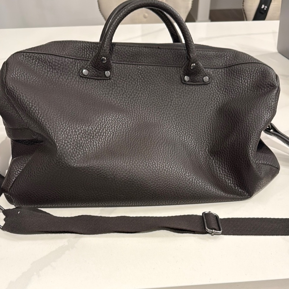 Zara Men's brown duffel bag.